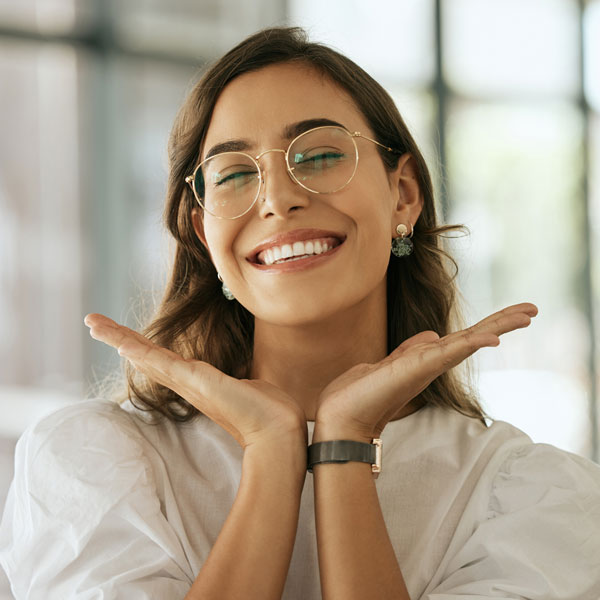 woman smiling with glasses